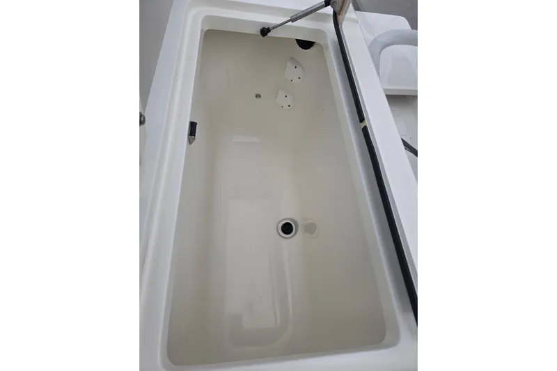 Seavee Yacht Photos Pics 2022 SeaVee 340Z boat storage compartment, white interior, open lid view.