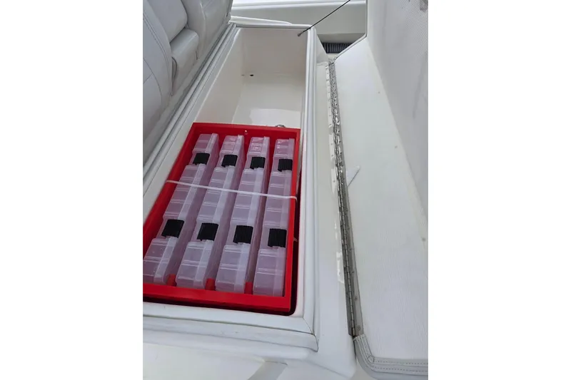 Seavee Yacht Photos Pics Storage compartment with organized tackle boxes on a 2022 SeaVee 340Z boat.