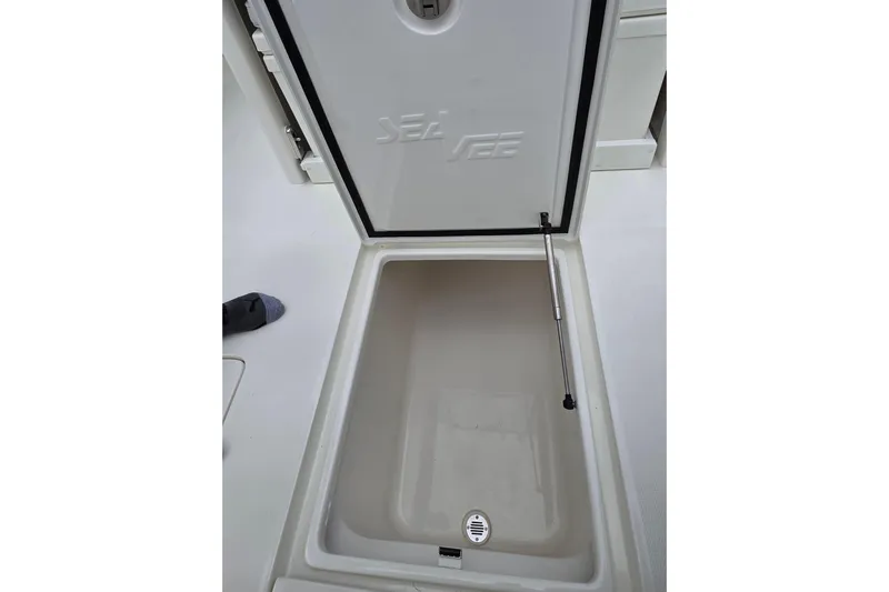 Seavee Yacht Photos Pics Open storage compartment on 2022 SeaVee 340Z boat, featuring hydraulic lift support.
