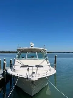  Yacht Photos Pics 2008 Grady-White Express 360 boat docked on calm water under clear blue sky.
