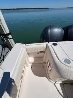  Yacht Photos Pics 2008 Grady-White Express 360 boat interior with twin engines, docked on calm water.