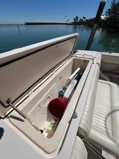  Yacht Photos Pics 2008 Grady-White Express 360 boat storage compartment open by the water.