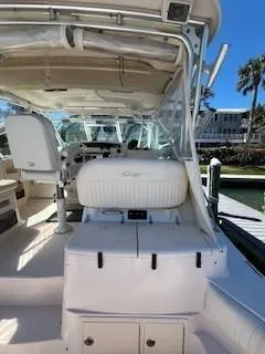  Yacht Photos Pics 2008 Grady-White Express 360 boat interior with seating and helm, docked under clear skies.
