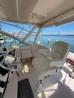  Yacht Photos Pics 2008 Grady-White Express 360 boat interior with helm and seating, overlooking a scenic waterfront.