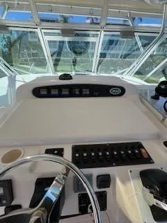  Yacht Photos Pics 2008 Grady-White Express 360 helm with control panel and steering wheel.