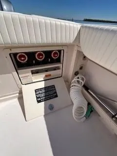  Yacht Photos Pics 2008 Grady-White Express 360 boat control panel with coiled hose on deck.