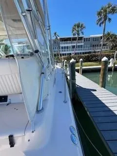  Yacht Photos Pics 2008 Grady-White Express 360 docked near waterfront buildings and palm trees.