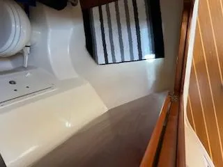  Yacht Photos Pics 2008 Grady-White Express 360 cabin interior with striped rug and wooden accents.