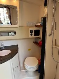  Yacht Photos Pics 2008 Grady-White Express 360 boat bathroom with sink, toilet, and shower.