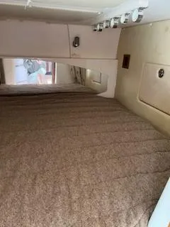  Yacht Photos Pics 2008 Grady-White Express 360 cabin interior with bed and storage compartments.