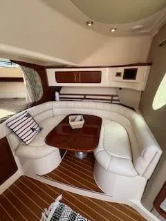  Yacht Photos Pics 2008 Grady-White Express 360 interior with white leather seating and wooden table.