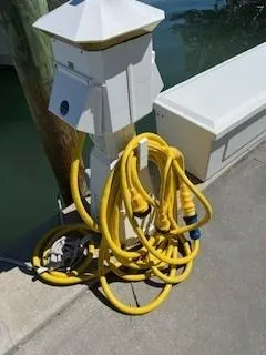  Yacht Photos Pics Yellow hoses coiled near a marina power pedestal, Grady-White Express 360, 2008.