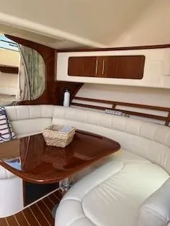  Yacht Photos Pics 2008 Grady-White Express 360 interior with elegant seating and wooden table.