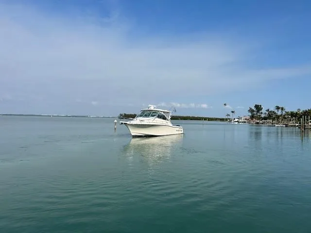  Yacht Photos Pics 2008 Grady-White Express 360 boat on calm water under clear blue sky.
