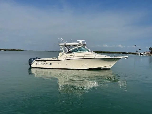  Yacht Photos Pics 2008 Grady-White Express 360 boat on calm water under clear sky.