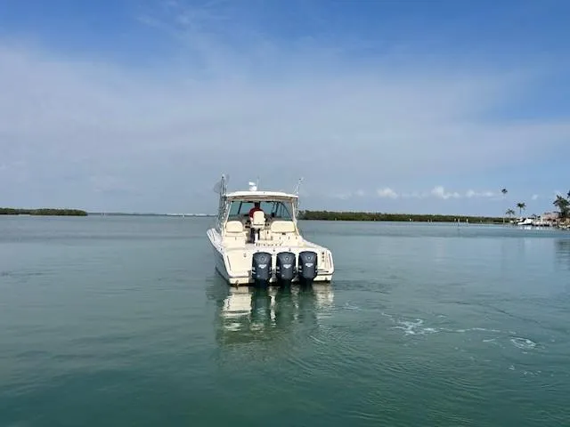  Yacht Photos Pics 2008 Grady-White Express 360 boat on calm water, clear sky background.