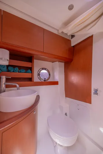 Ms Bordeaux Yacht Photos Pics Luxurious bathroom in 2013 Beneteau GRAN TURISMO 38 yacht with modern fixtures and wood accents.