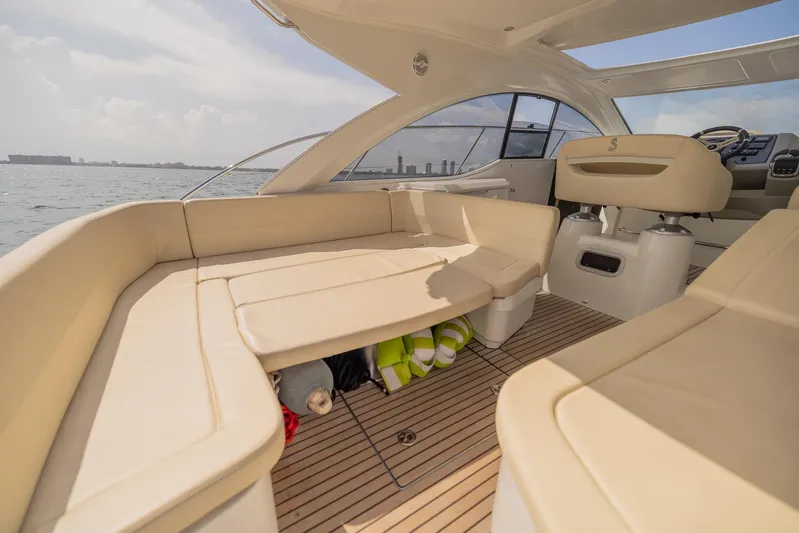 Ms Bordeaux Yacht Photos Pics Interior of 2013 Beneteau Gran Turismo 38 yacht with beige seating and ocean view.
