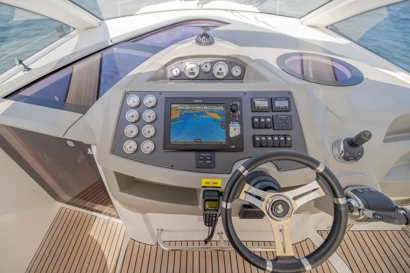 Ms Bordeaux Yacht Photos Pics Cockpit of 2013 Beneteau Gran Turismo 38 with navigation controls and steering wheel.
