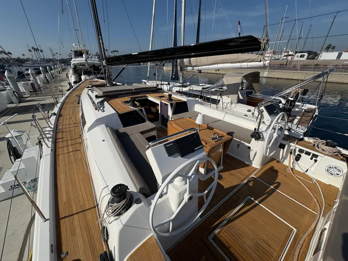 560 Exclusive Yacht Photos Pics Luxury 2018 Dufour 560 Exclusive yacht with spacious deck and dual steering wheels in marina.