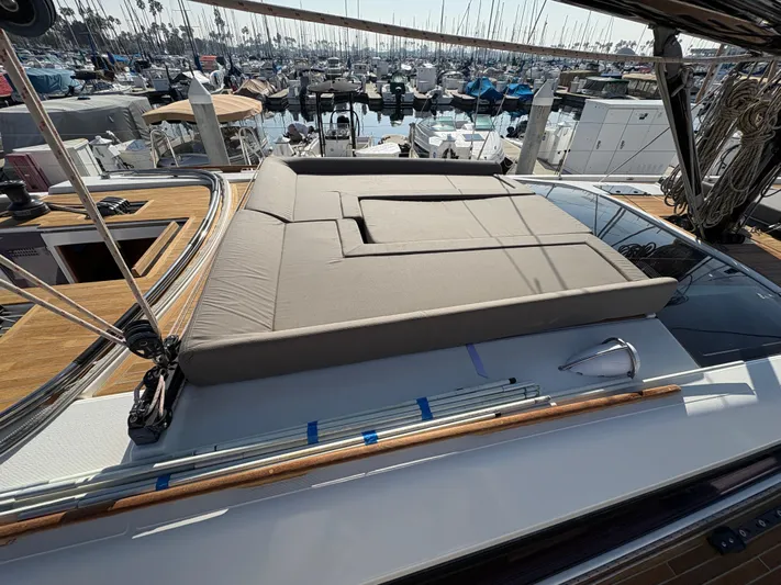 560 Exclusive Yacht Photos Pics 2018 Dufour 560 Exclusive yacht with sunbed, docked in a marina.