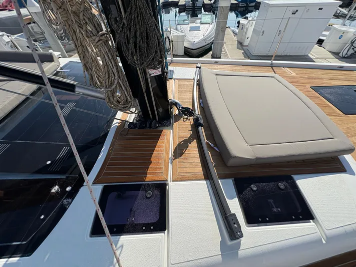 560 Exclusive Yacht Photos Pics Dufour 560 Exclusive 2018 yacht deck with seating and rigging at a marina.