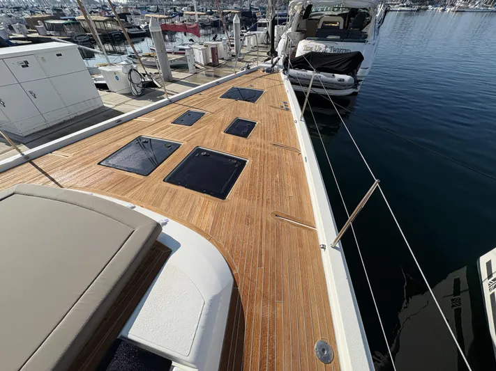 560 Exclusive Yacht Photos Pics 2018 Dufour 560 Exclusive yacht with teak deck, docked at marina.