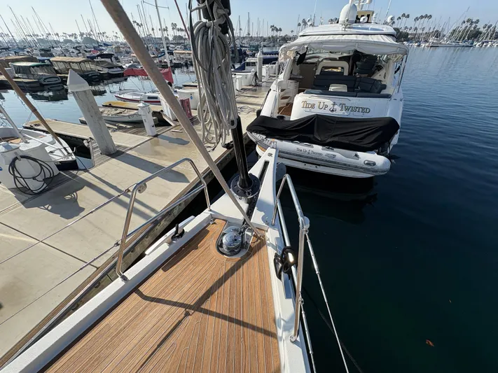 560 Exclusive Yacht Photos Pics Dufour 560 Exclusive 2018 yacht docked at marina, with view of neighboring boat.