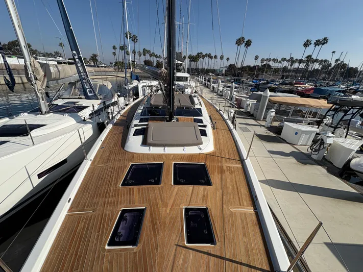 560 Exclusive Yacht Photos Pics Dufour 560 Exclusive 2018 yacht docked, showcasing sleek deck design and marina backdrop.