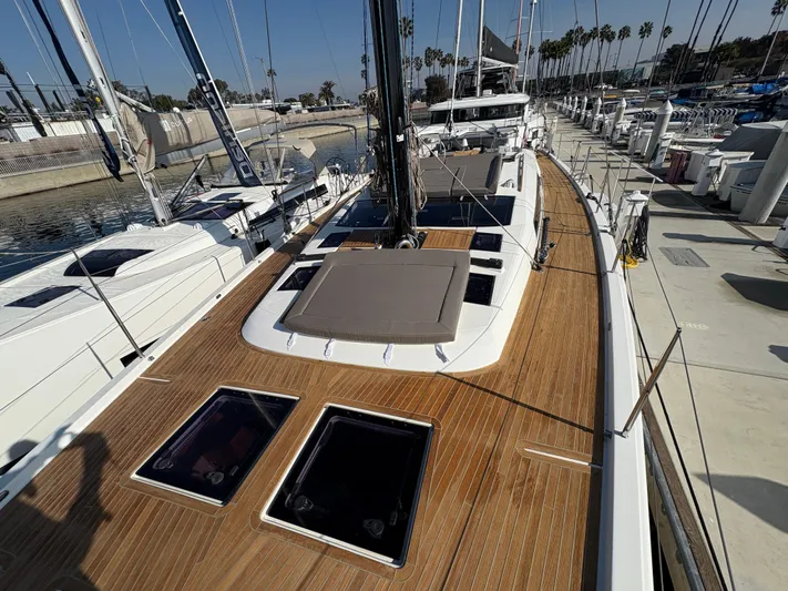 560 Exclusive Yacht Photos Pics 2018 Dufour 560 Exclusive yacht with teak deck, docked at marina.