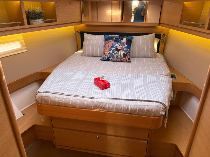 560 Exclusive Yacht Photos Pics Cozy bedroom in 2018 Dufour 560 Exclusive yacht with elegant bedding and ambient lighting.