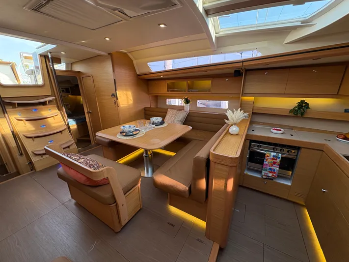 560 Exclusive Yacht Photos Pics Luxurious interior of 2018 Dufour 560 Exclusive yacht with modern kitchen and dining area.