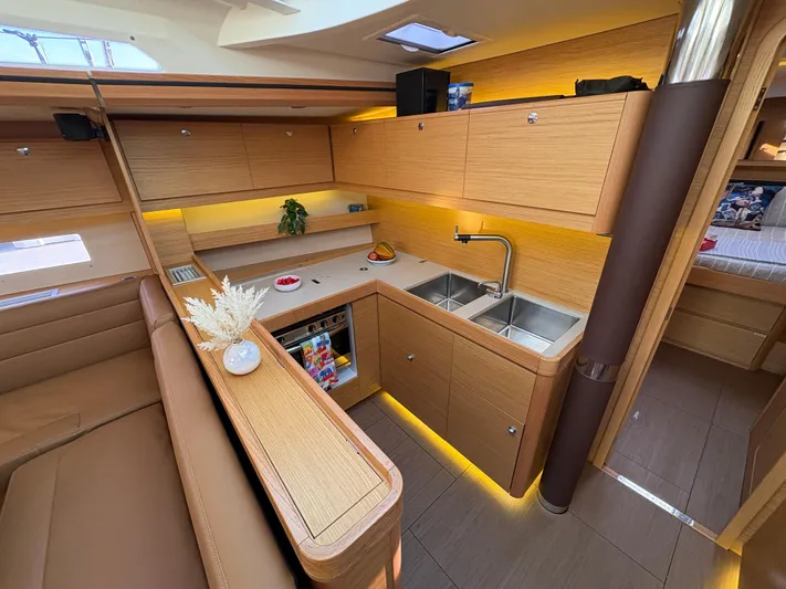 560 Exclusive Yacht Photos Pics Luxurious interior of 2018 Dufour 560 Exclusive yacht with modern kitchen design.