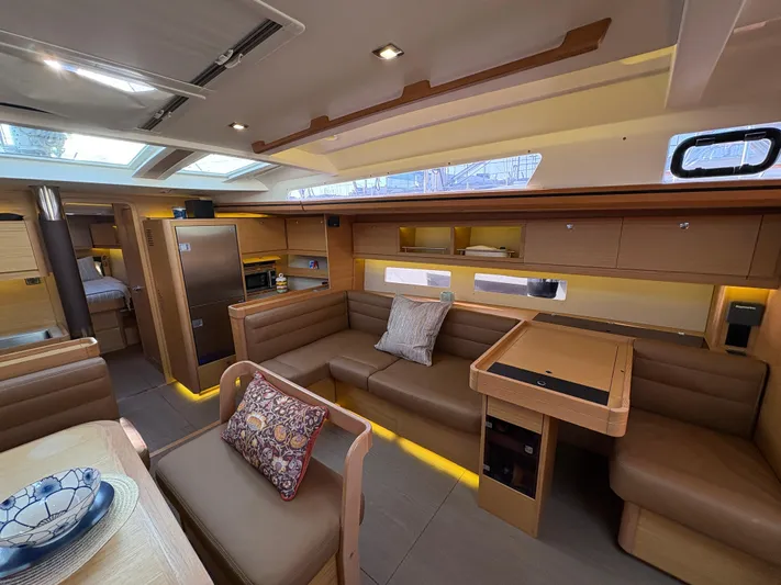 560 Exclusive Yacht Photos Pics Luxurious interior of 2018 Dufour 560 Exclusive yacht with modern furnishings and ample seating.