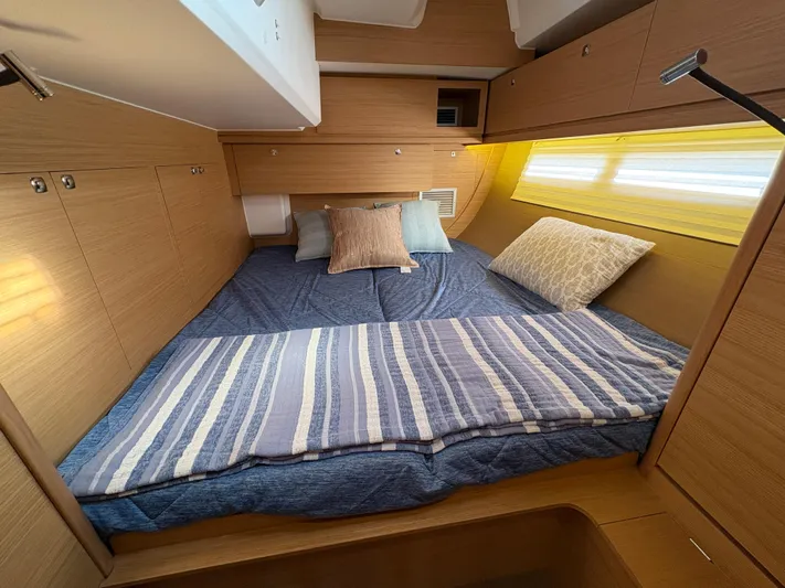 560 Exclusive Yacht Photos Pics Cozy cabin interior of 2018 Dufour 560 Exclusive yacht with comfortable bedding.