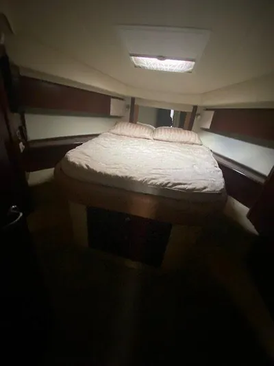  Yacht Photos Pics Interior of 2006 Sea Ray 44 Sedan Bridge with cozy bed.