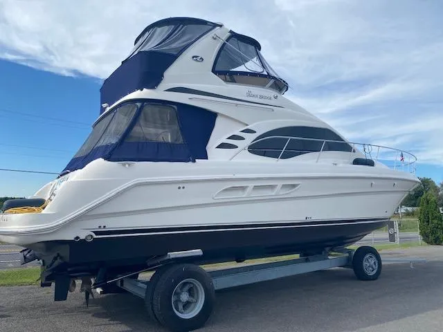 Yacht Photos Pics 2006 Sea Ray 44 Sedan Bridge on trailer, blue sky.