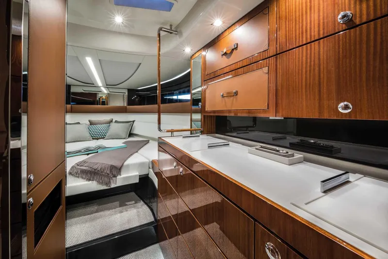  Yacht Photos Pics Luxurious interior of 2023 Riva 38 Rivamare yacht with elegant wood finishes and modern design.