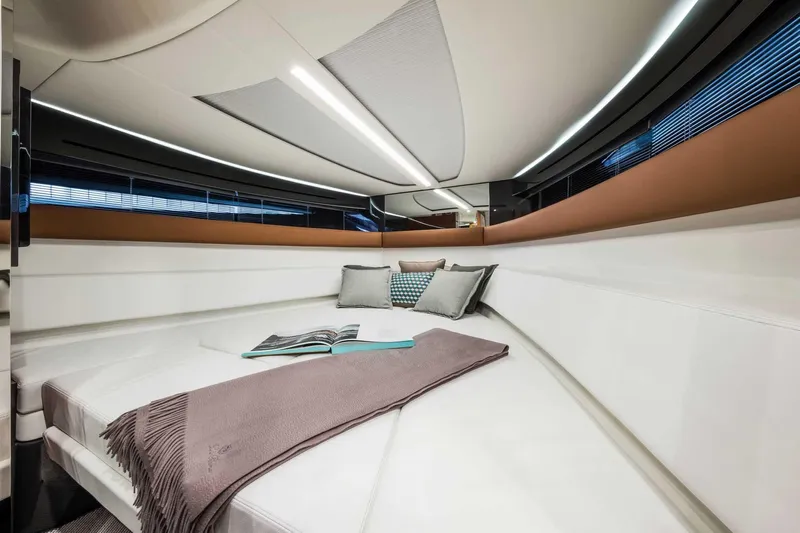  Yacht Photos Pics Luxurious interior of 2023 Riva 38 Rivamare yacht with elegant bedding and modern design.