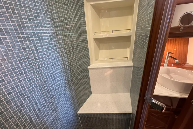  Yacht Photos Pics Luxurious bathroom interior of 2020 Vicem 50 Classic yacht with modern fixtures and tiled walls.