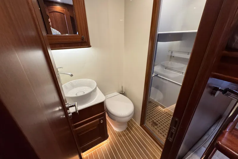  Yacht Photos Pics Luxurious bathroom in 2020 Vicem 50 Classic yacht with wooden accents and modern fixtures.