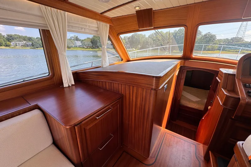  Yacht Photos Pics Interior of 2020 Vicem 50 Classic yacht with elegant wood finish and scenic window views.