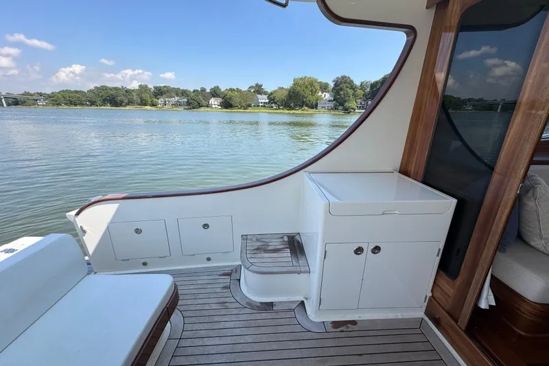  Yacht Photos Pics Vicem 50 Classic 2020 yacht interior with wooden accents and serene water view.