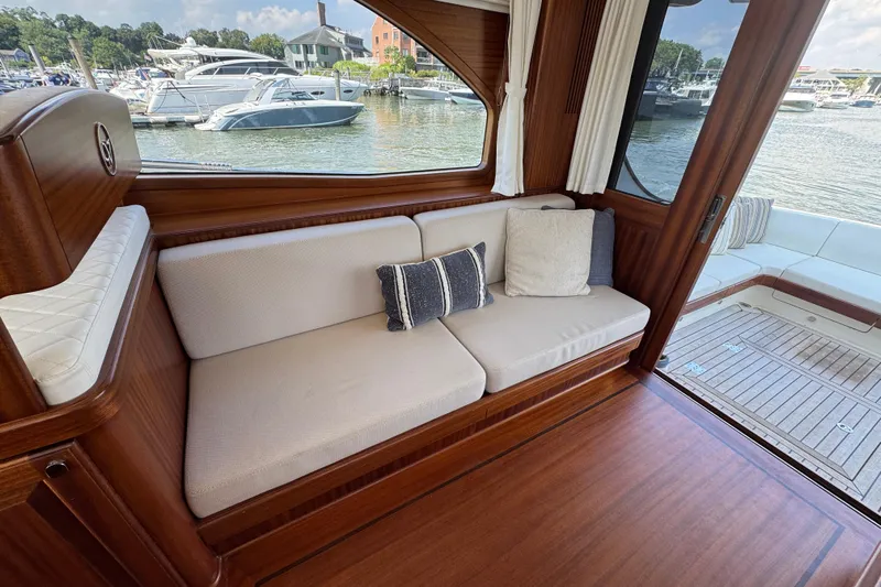  Yacht Photos Pics Luxurious interior of 2020 Vicem 50 Classic yacht with elegant seating and scenic marina view.