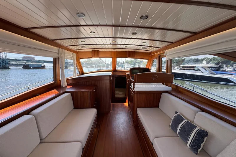  Yacht Photos Pics Elegant interior of 2020 Vicem 50 Classic yacht with wooden finishes and waterfront views.