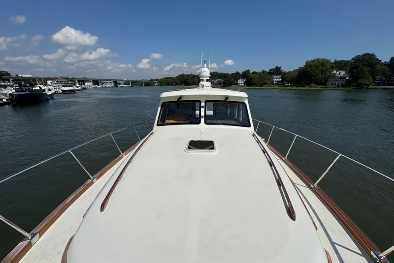  Yacht Photos Pics 2020 Vicem 50 Classic yacht on a serene river with clear skies.