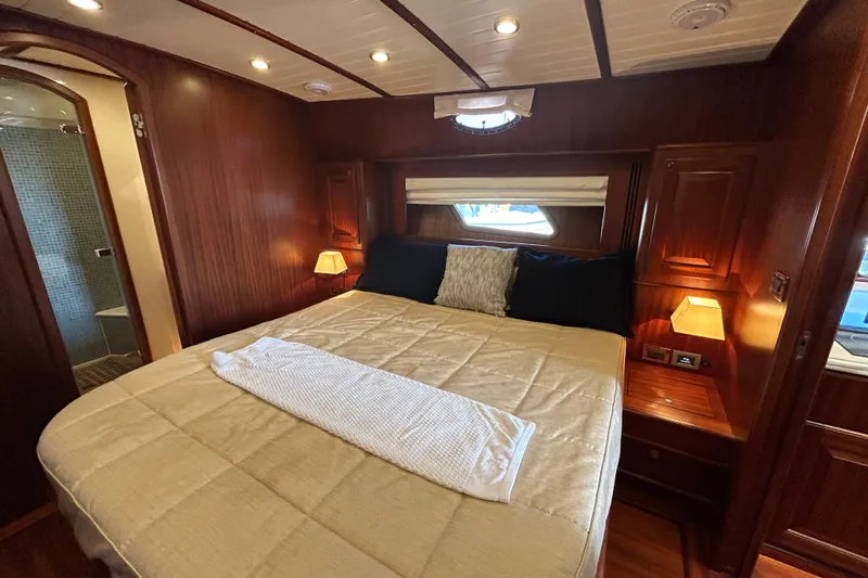  Yacht Photos Pics Luxurious cabin interior of 2020 Vicem 50 Classic yacht with elegant wood finish.