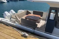 Luxury Nimbus T11 2021 yacht with spacious seating and twin engines docked at marina.