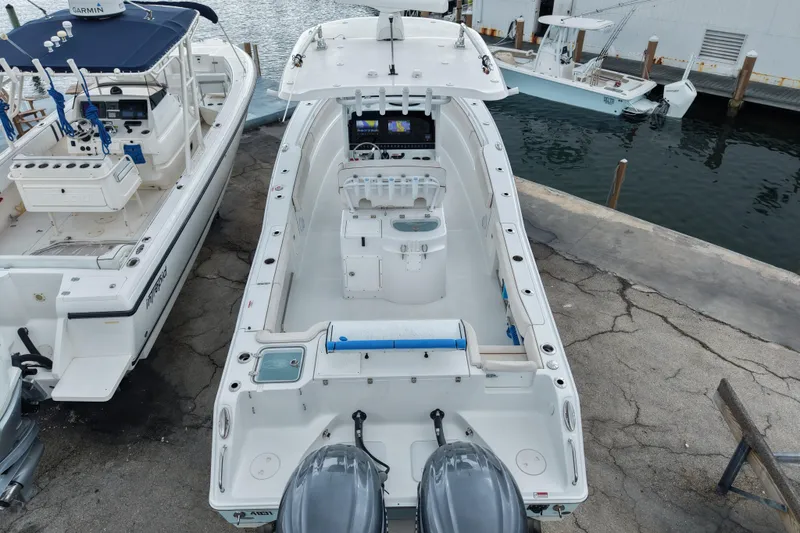  Yacht Photos Pics 2021 Sea Hunt Gamefish 30 Coffin Box boat docked, featuring dual engines and spacious deck.