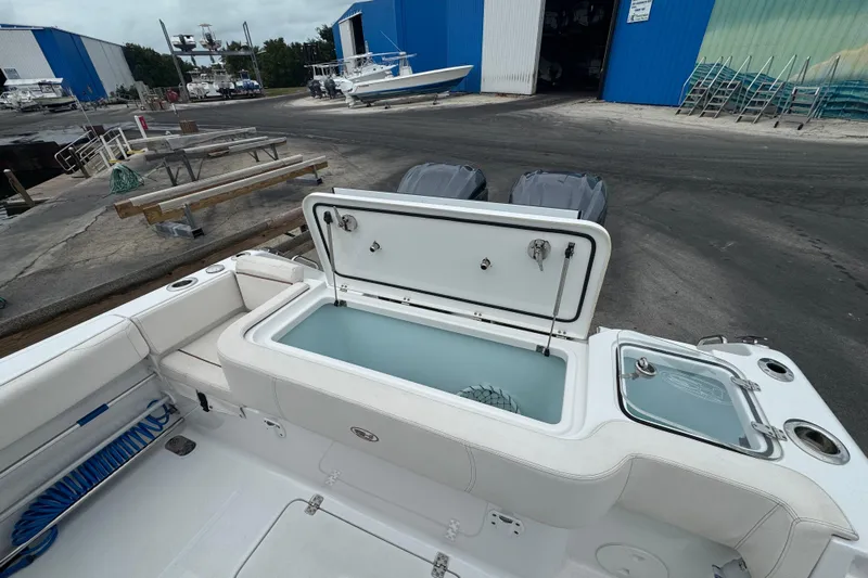  Yacht Photos Pics 2021 Sea Hunt Gamefish 30 Coffin Box boat with open storage compartment at marina.
